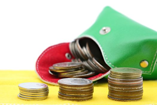 Stack of coins on a yellow cloth