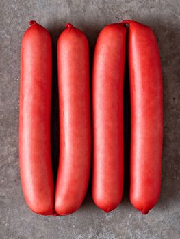 close up of rustic english saveloy red pork sausage