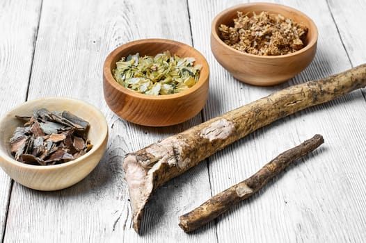 Medicinal plants,herbs in the wooden bowl and inula root