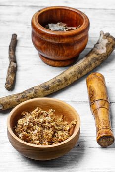 Medicinal plants,herbs in the wooden bowl and inula root