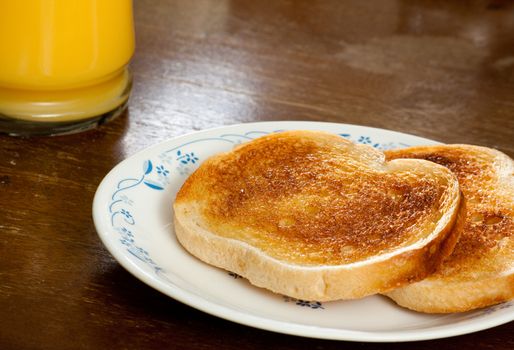 Two slices of toast and a side of OJ