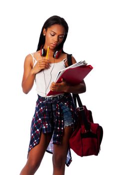 Beautiful student standing thinking with pencil and notepad binders coming up with ideas, on white.