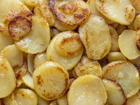 close up of rustic german bratkartofflen fried potatoes food background