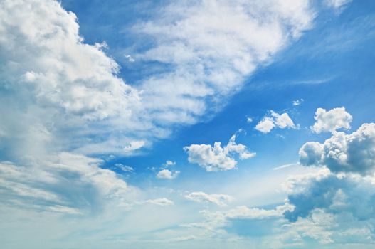 fluffy clouds in the blue sky