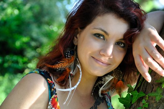 portrait of red  hair woman in a park