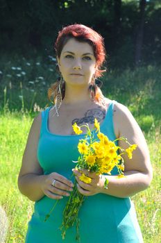 Woman in a meadow with flowers