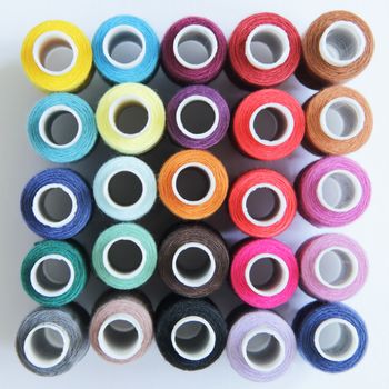 Sewing threads of different colors in beautiful pattern