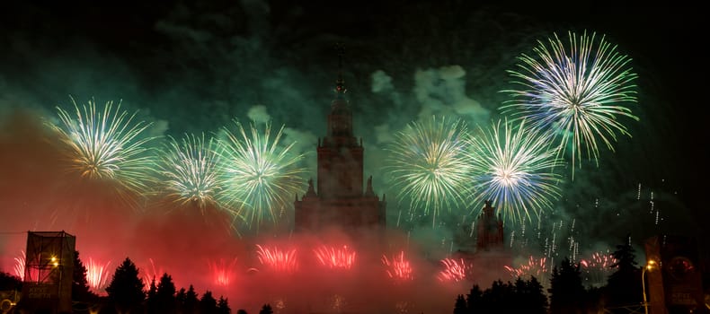 Moscow, Russia - September 25, 2016: Fireworks in the sky at the festival "Circle of Light" on the background of the Lomonosov Moscow State University