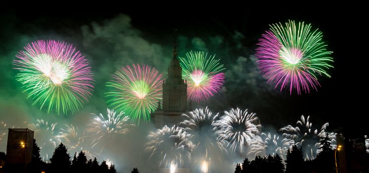 Moscow, Russia - September 25, 2016: Fireworks in the sky at the festival "Circle of Light" on the background of the Lomonosov Moscow State University