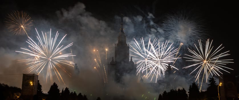 Moscow, Russia - September 25, 2016: Fireworks in the sky at the festival "Circle of Light" on the background of the Lomonosov Moscow State University