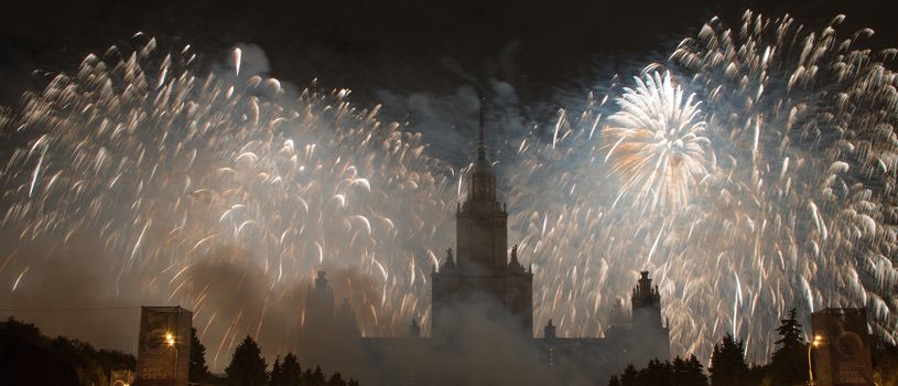 Moscow, Russia - September 25, 2016: Fireworks in the sky at the festival "Circle of Light" on the background of the Lomonosov Moscow State University