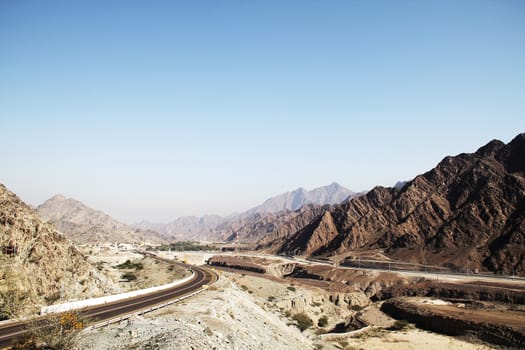 Mountain road in UAE with blue sky