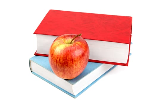 books and red apple isolated on white background