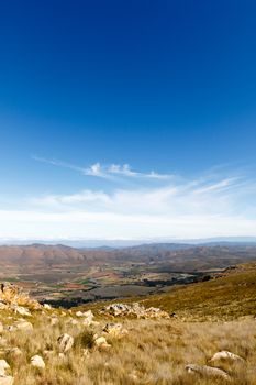 Portrait view - Farmland on a plato with mountains in the background looking over the beautiful Swartberg