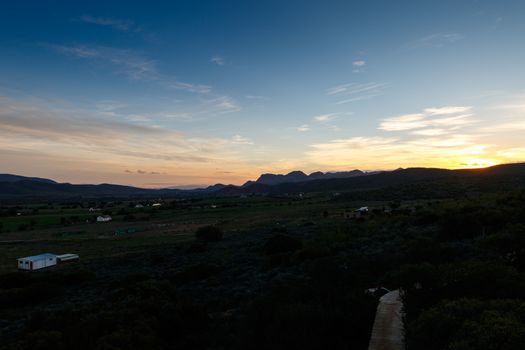 Beautiful orange, white and blue Sunset over Middelplaas, De Rust