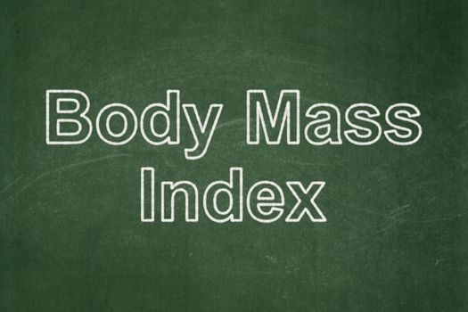 Medicine concept: text Body Mass Index on Green chalkboard background