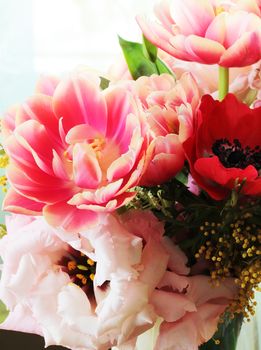 Bouquet of different flowers including tulips and mimosa