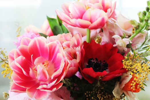 Bouquet of different flowers including tulips and mimosa