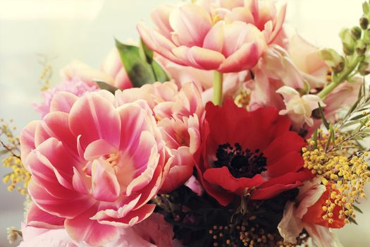 Bouquet of different flowers including tulips and mimosa