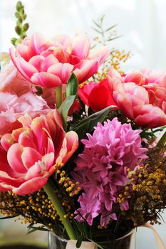 Bouquet of different flowers including tulips and mimosa