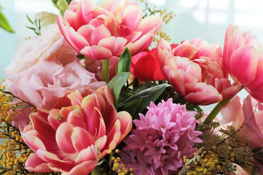 Bouquet of different flowers including tulips and mimosa