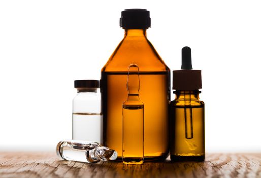 medicament in a glass vial closeup on white background