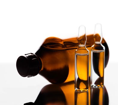 medicament in a glass vial on white background