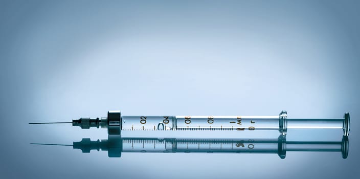 with the reflection of closeup a medical syringe