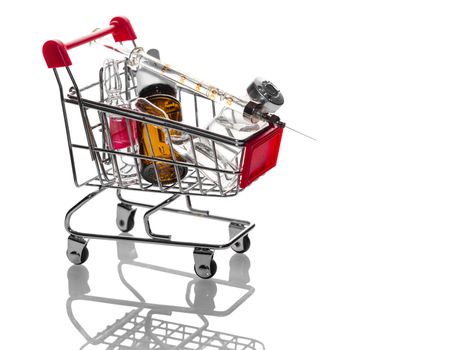 medications in the trolley on a white background