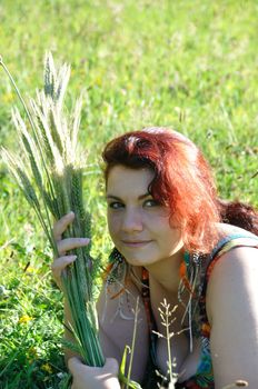 portrait of red  hair woman in a park