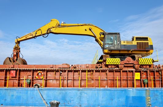 big excavator on general cargo ship