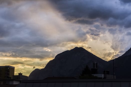 Beautiful and colorful sunset behind the Mountains at the Austrian Alps close to Innsbruck.