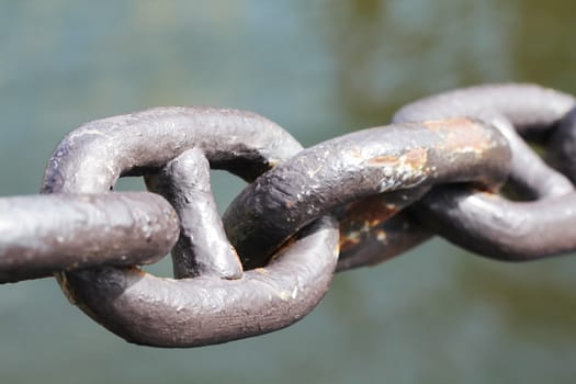 Strong old chain close up in ship port