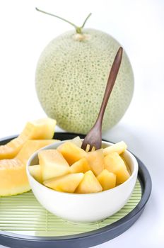 freshly cut cantaloupe melon on white background