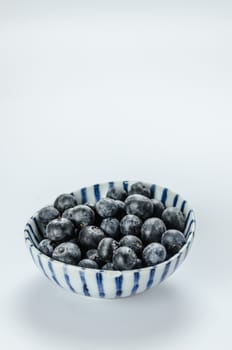 Blueberries in a bowl , organic fresh fruit