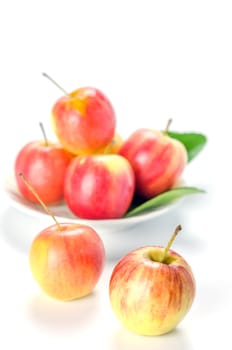 Red and yellow apple with white bowl , organic fresh fruit