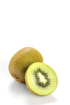 delicious whole kiwi fruit and half on white background