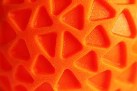 Orange rubber texture with triagle pattern close up bright
