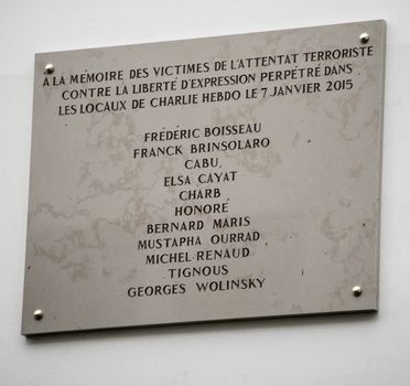 FRANCE, Paris: A picture taken on January 5, 2016 shows a memorial plaque bearing the names of the victims of the Charlie Hebdo attack on January 7, 2015. The name of cartoonist Wolinski was misspelled Wolinsky and Paris city hall said on January 5, 2016 it will be fixed within an hour. 