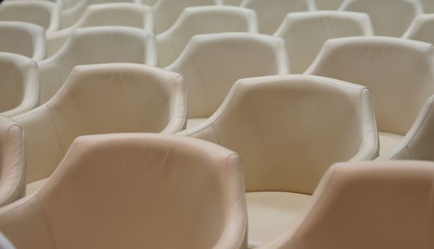 Conference room is preparing with leather chair before meeting at office.