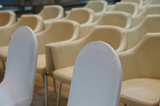 Conference room is preparing with leather chair before meeting at office.