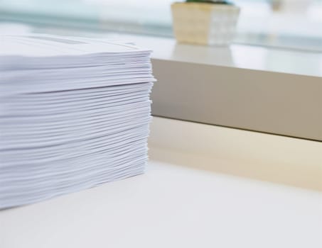 Stack of paper was put on table at office environment.                              