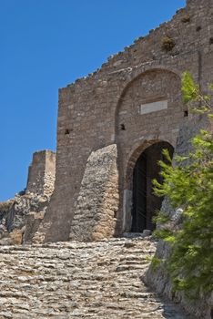 The walls and the main entrance to the old fortress of the ancient Acrocorinth. Peloponnese, Greece.