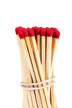 bundle of matches with rad heads isolated on white background, close up