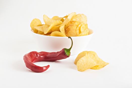 potato chips and chili in isolated white plate.