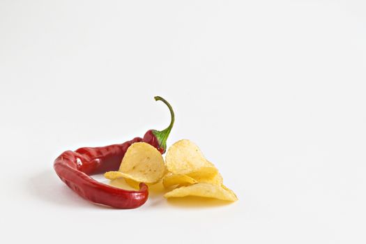 potato chips and chili in isolated white plate.