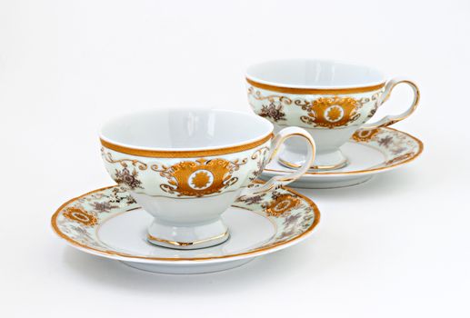 vintage tea set with gold decor isolated.