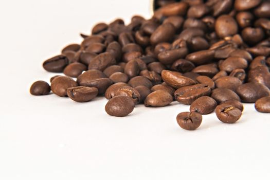 background of coffee beans on a white background isolation.