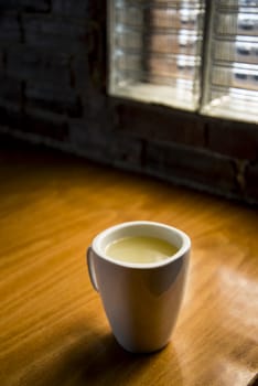 Closeup of cup of tea on a wooden background