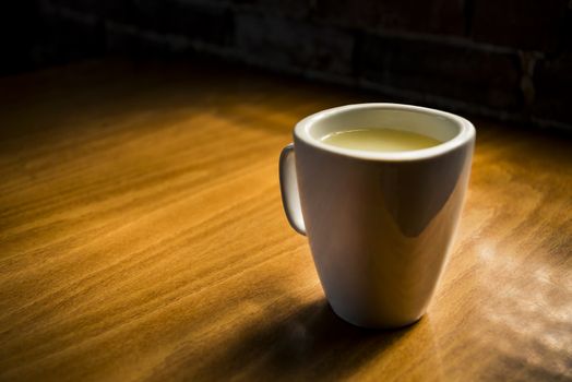 Closeup of cup of tea on a wooden background